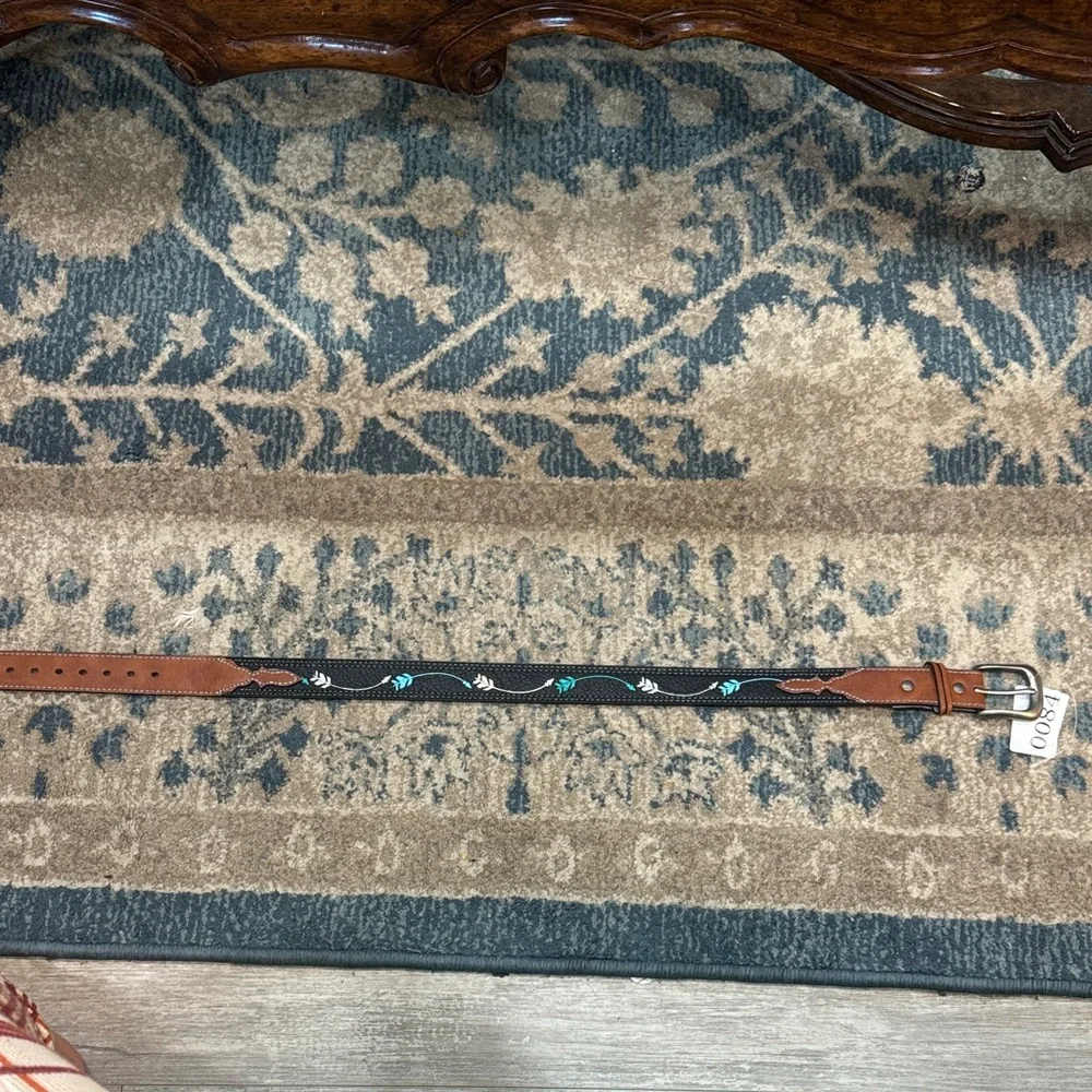 This is a Catchfly leather belt with arrow embroidery size small